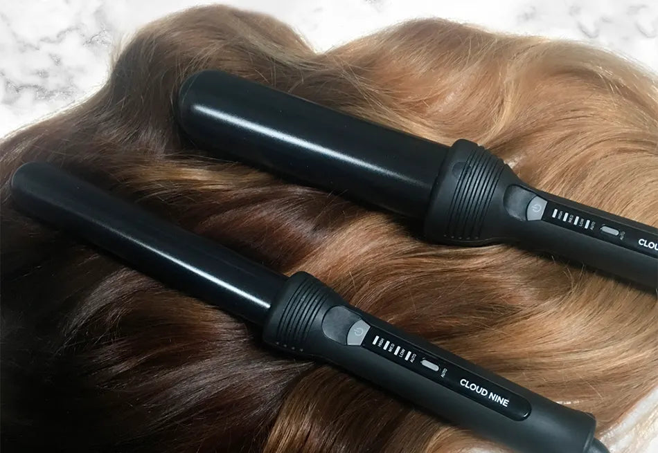 The Waving Wand and The Curling Wand next to each other on wavy light brown hair.