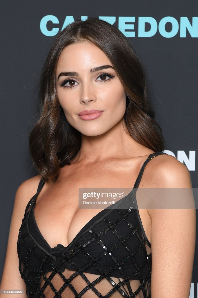 Image of Olivia Culpo with brown curly hair.