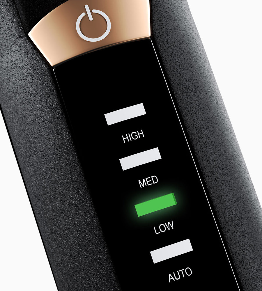 Close up of the variable temperature control settings on The Alchemy Collection Curling Wand.