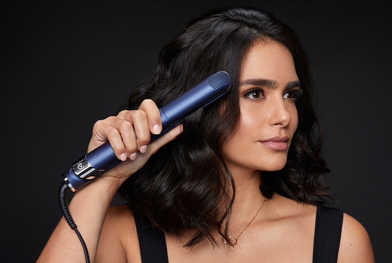Model curling her short, black hair with the 2-in-1 Contouring Iron Pro.