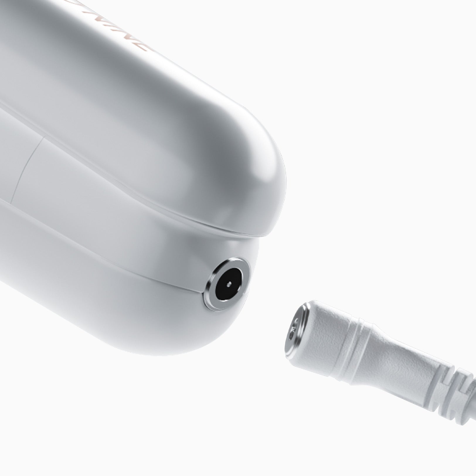 Close up of the magnetic charging port on the white Original Cordless Iron.