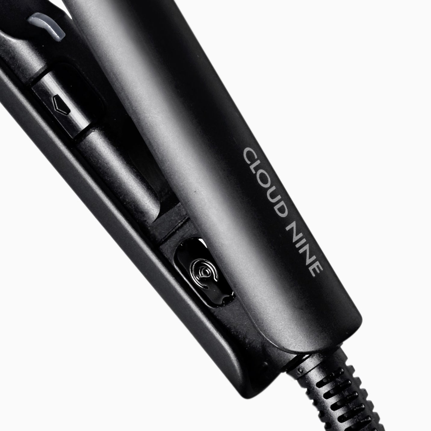 Close up of black CLOUD NINE Micro Iron at the hinge against a white background.