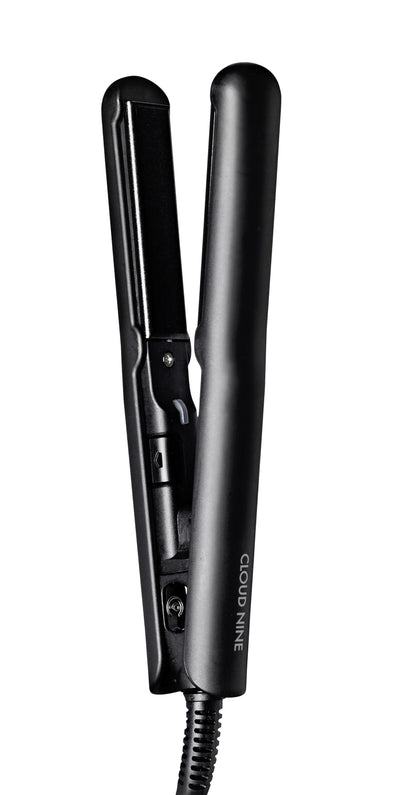 Full view of six-inch, black CLOUD NINE Micro Iron standing upright on white background.