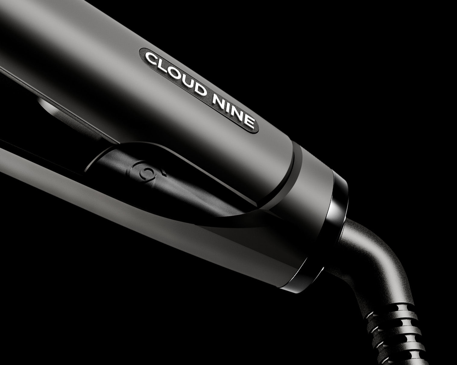 Close up of the bottom of the Original Iron featuring the CLOUD NINE brand logo and the 360° Swivel Cord.