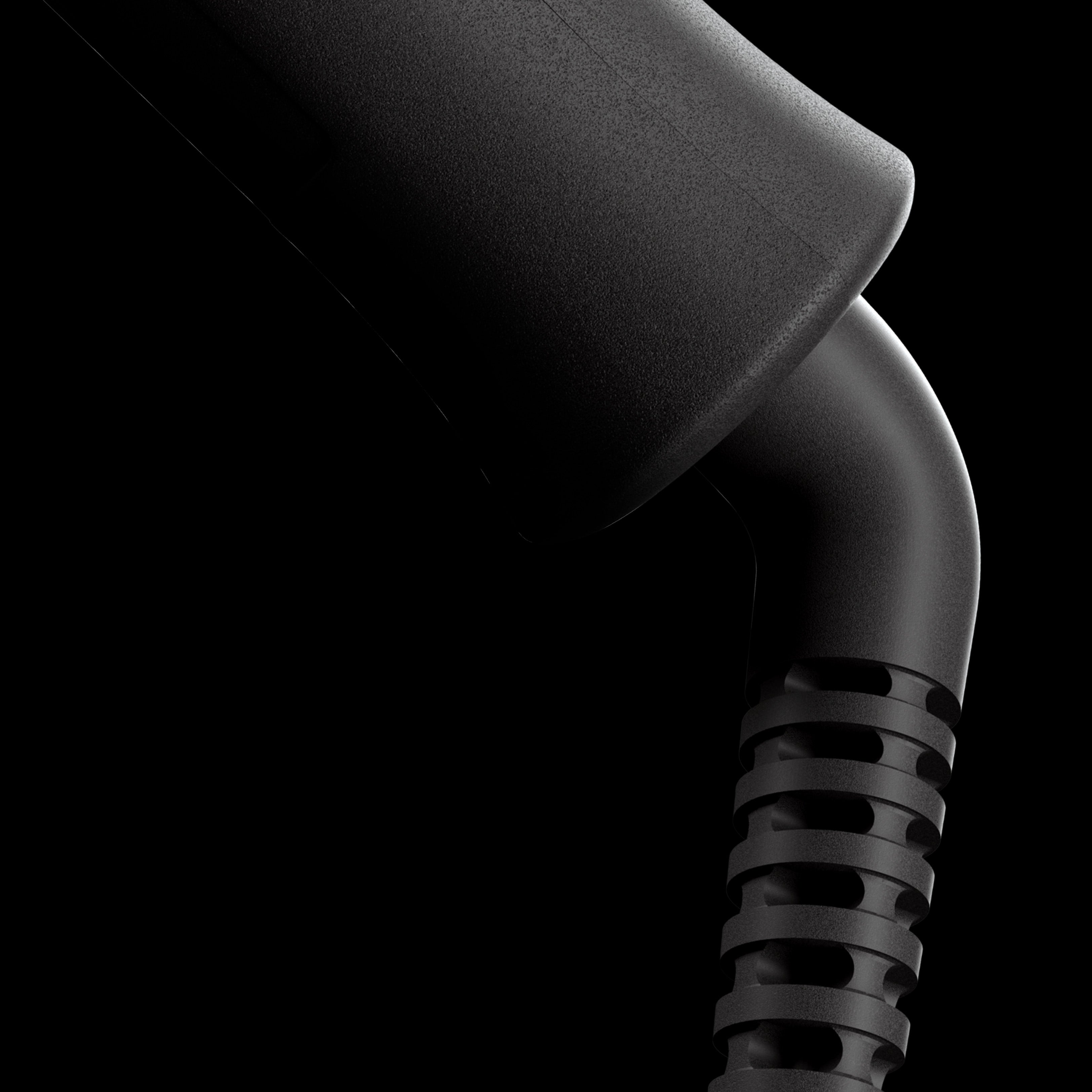 A close-up of the pivoting cord on the black CLOUD NINE Texture Wand.