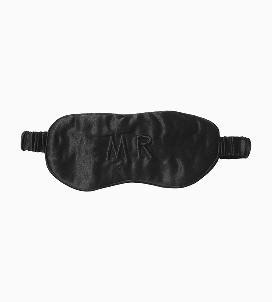 a black eye mask with Mr. emblazoned.