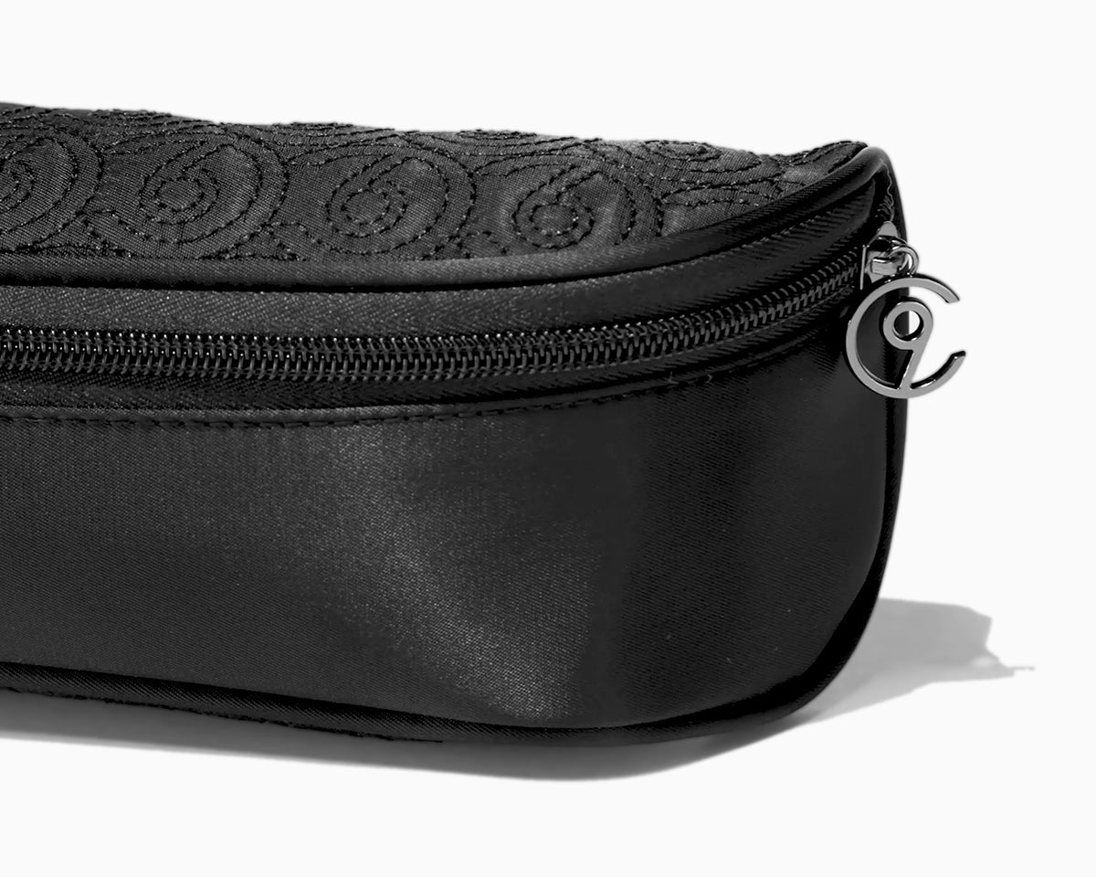 Close up of detailing on the black style case, including a CLOUD NINE zip.