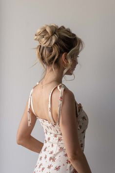 Image of a model with a messy high bun.