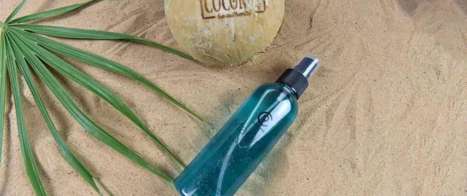 The Magical Potion on a beach style background with a coconut and a leaf.