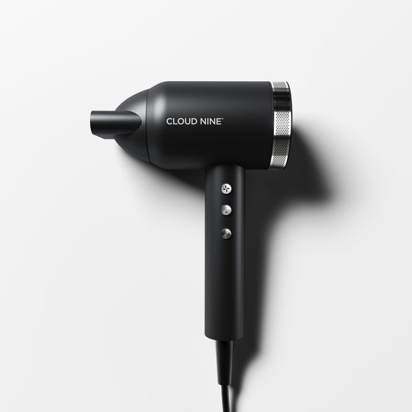 Cloud Nine Airshot Pro hair dryer in Black with silver chrome filter and three-button control panel, shown at an angle on a white background