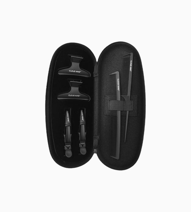 An open clamshell case with CLOUD NINE croc clips, hair clips and combs inside.