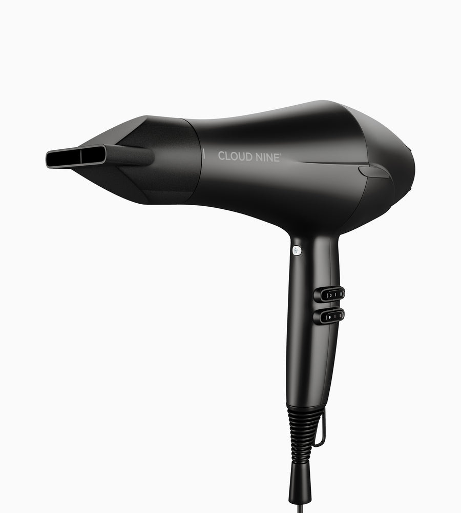 Full view of The Airshot hair dryer in black with a concentrator nozzle attached.