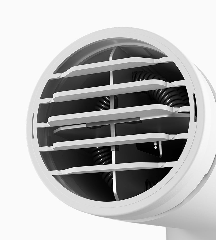 The front of a white Airshot Pro hair dryer with heating coil visible inside.