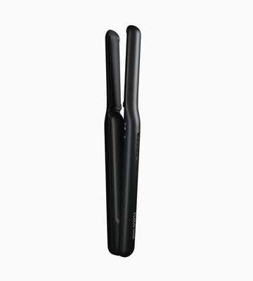 Vertical full product image of the CLOUD NINE Original Cordless Iron in black.