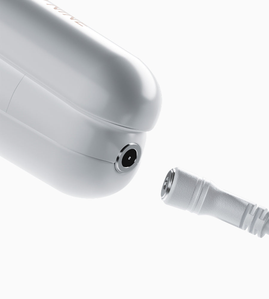Close up of the magnetic charging port on the white Original Cordless Iron.
