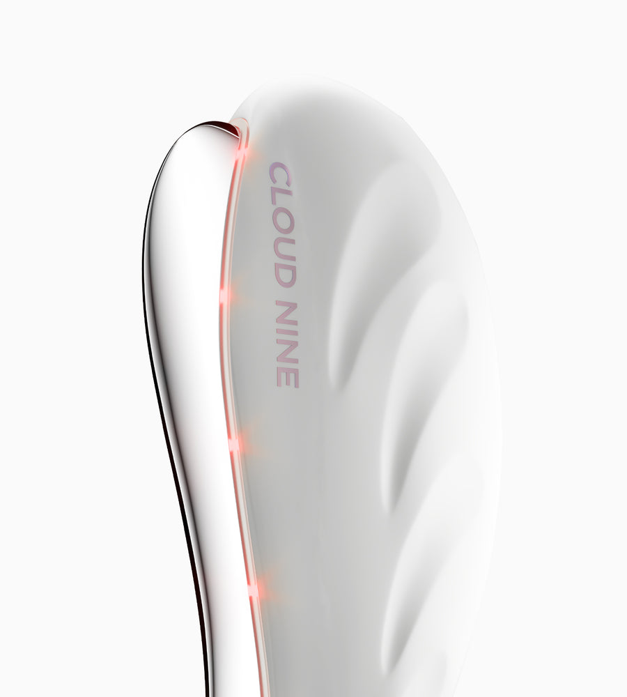 Close up of The Redefine Beauty Device on red mode.