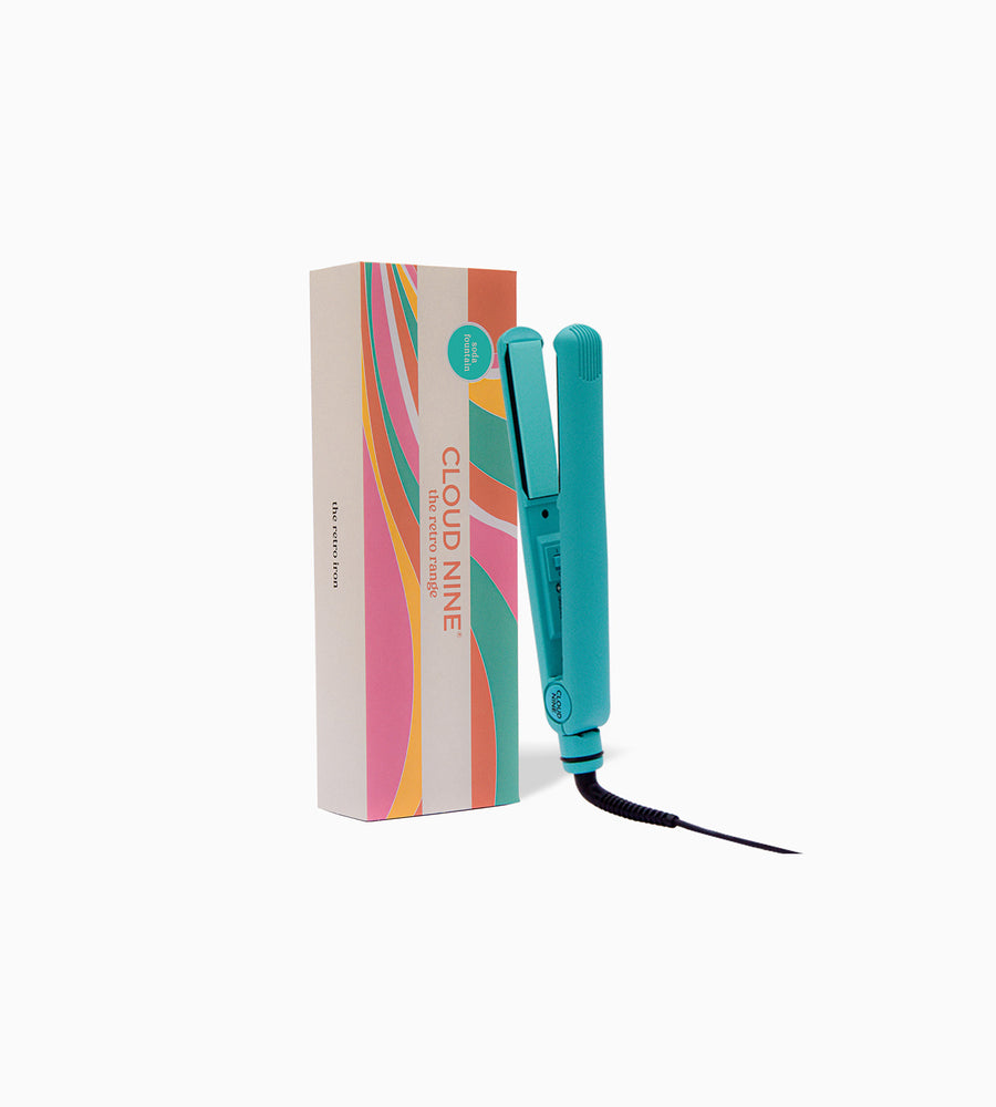 Zoomed out image showing blue CLOUD NINE straighteners with packaging on white background.