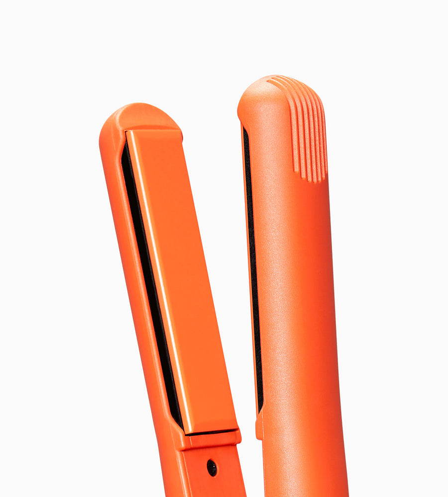 Zoomed out image of orange CLOUD NINE straighteners.