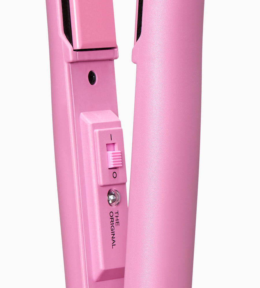 Close-up image showing temperature controls on pink CLOUD NINE straighteners on white background.