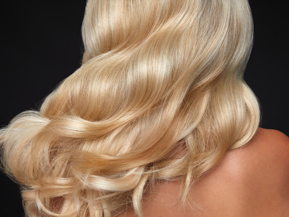 Close up of blonde wavy hair.