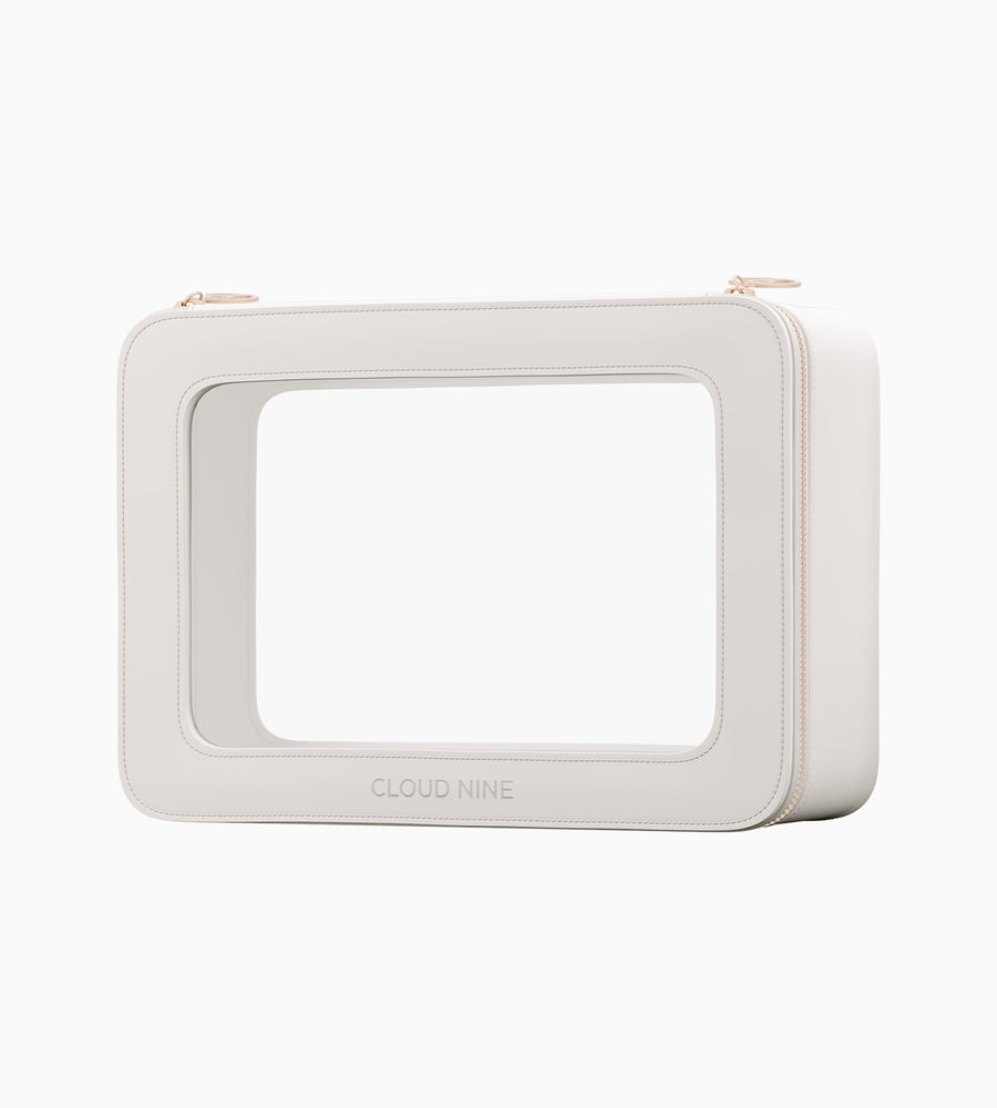 A zoomed out image of white CLOUD NINE Luxury Travel Bag turned slightly on white background.