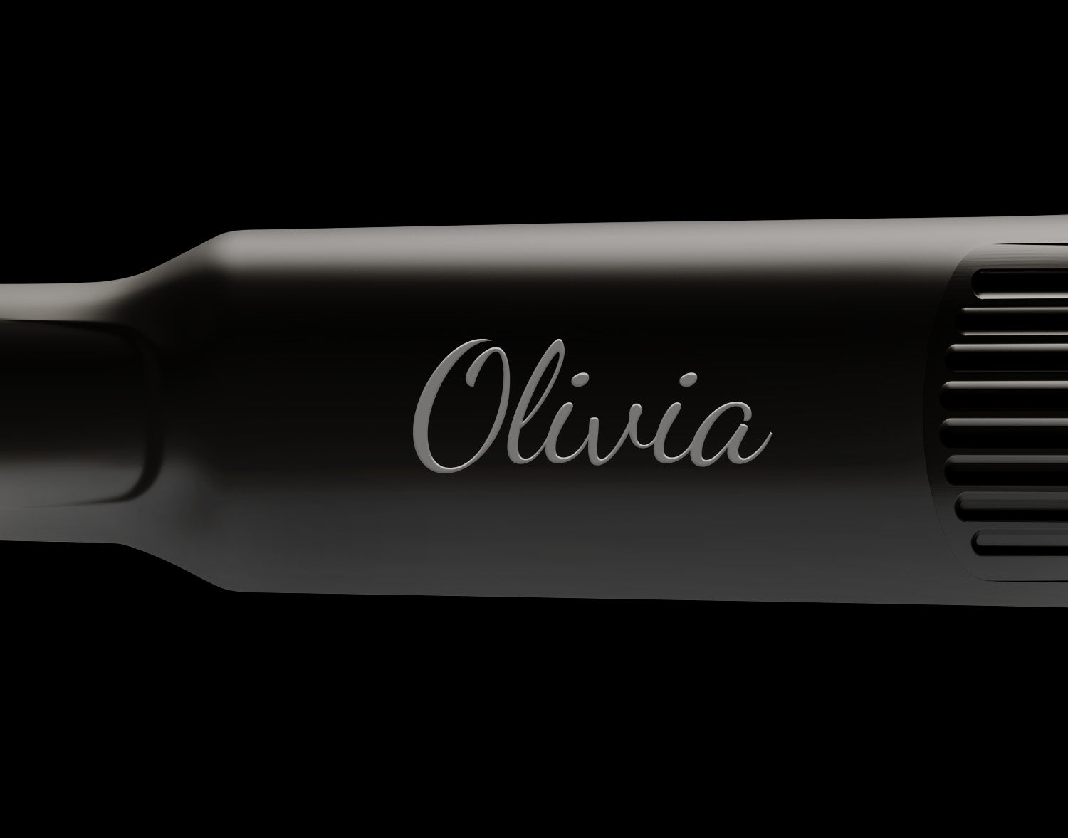 Close-up of black CLOUD NINE hair straightener monogrammed with the name Olivia.