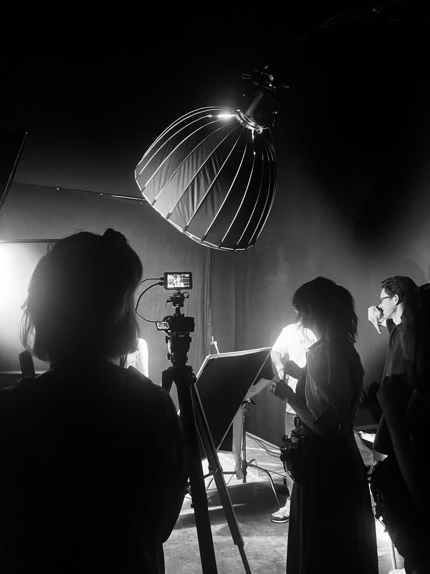 A black and white image of a CLOUD NINE production shoot.