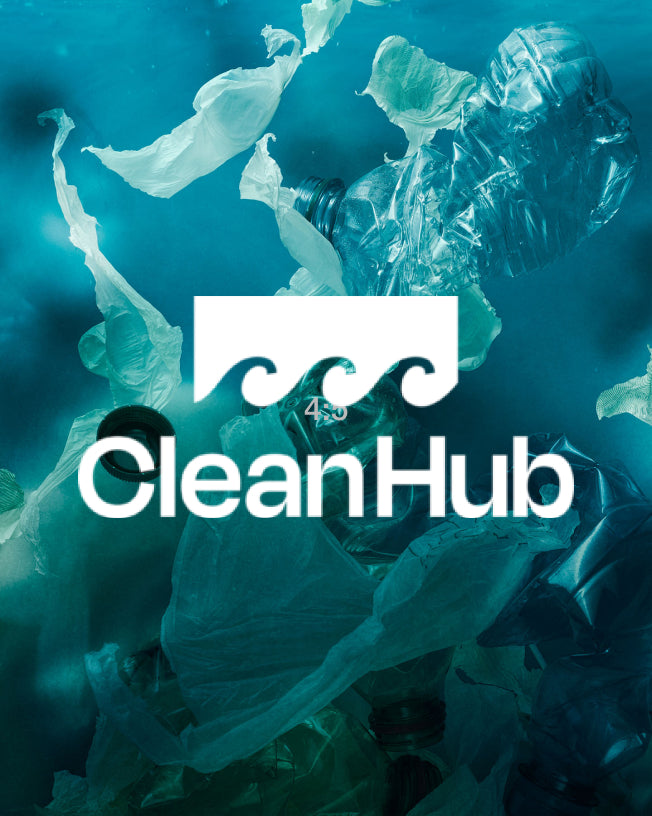 Plastic floating underwater with the CleanHub logo in the centre.