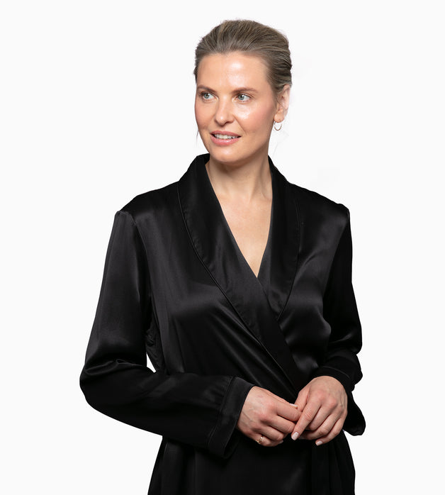 Blonde model in dressed in a black silk robe.
