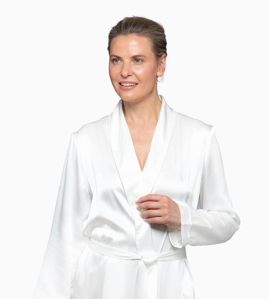 Model in a white silk robe.