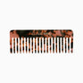 A CLOUD NINE Luxury Texture Comb in tortoise shell on a white background.