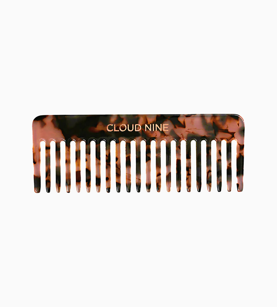 A CLOUD NINE Luxury Texture Comb in tortoise shell on a white background.