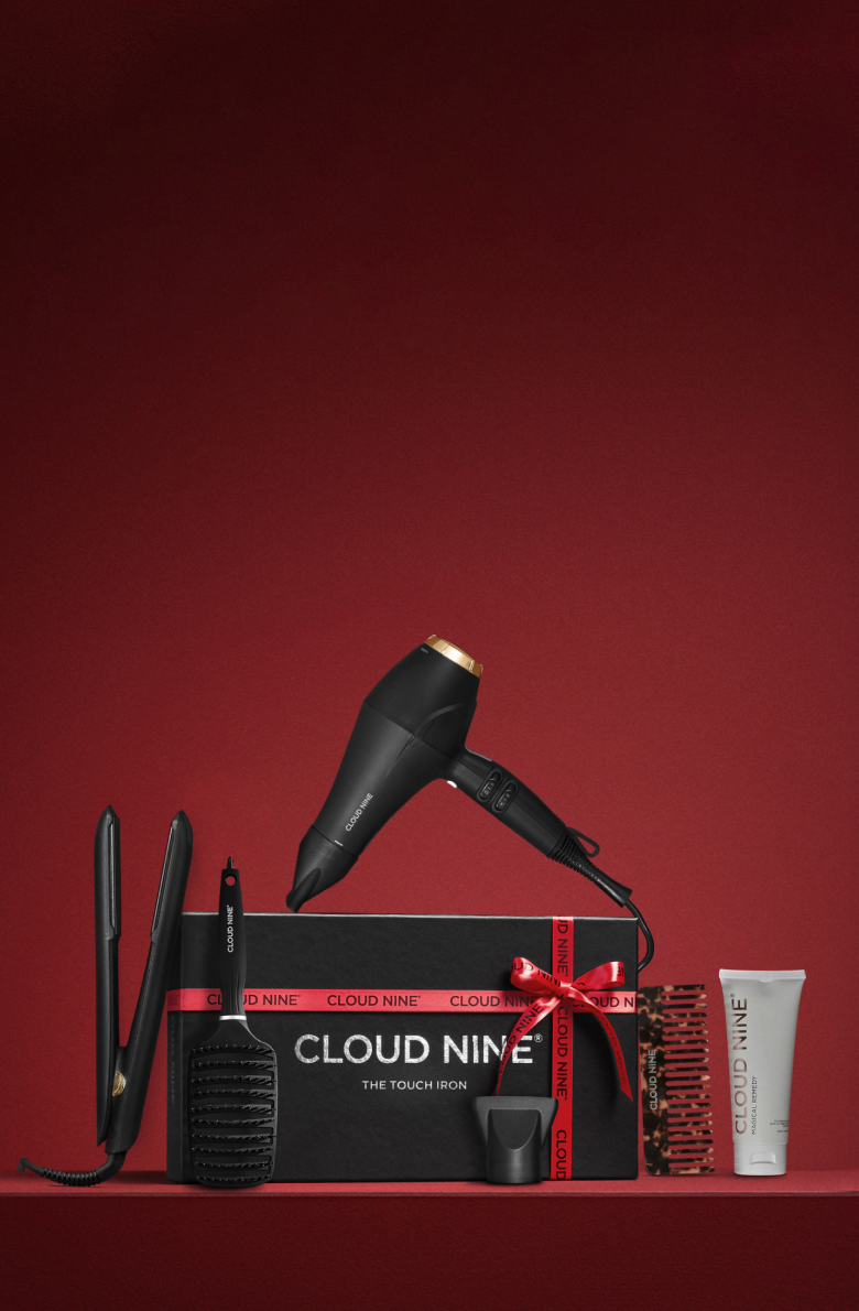 Cloud Nine hair care product set on a red background