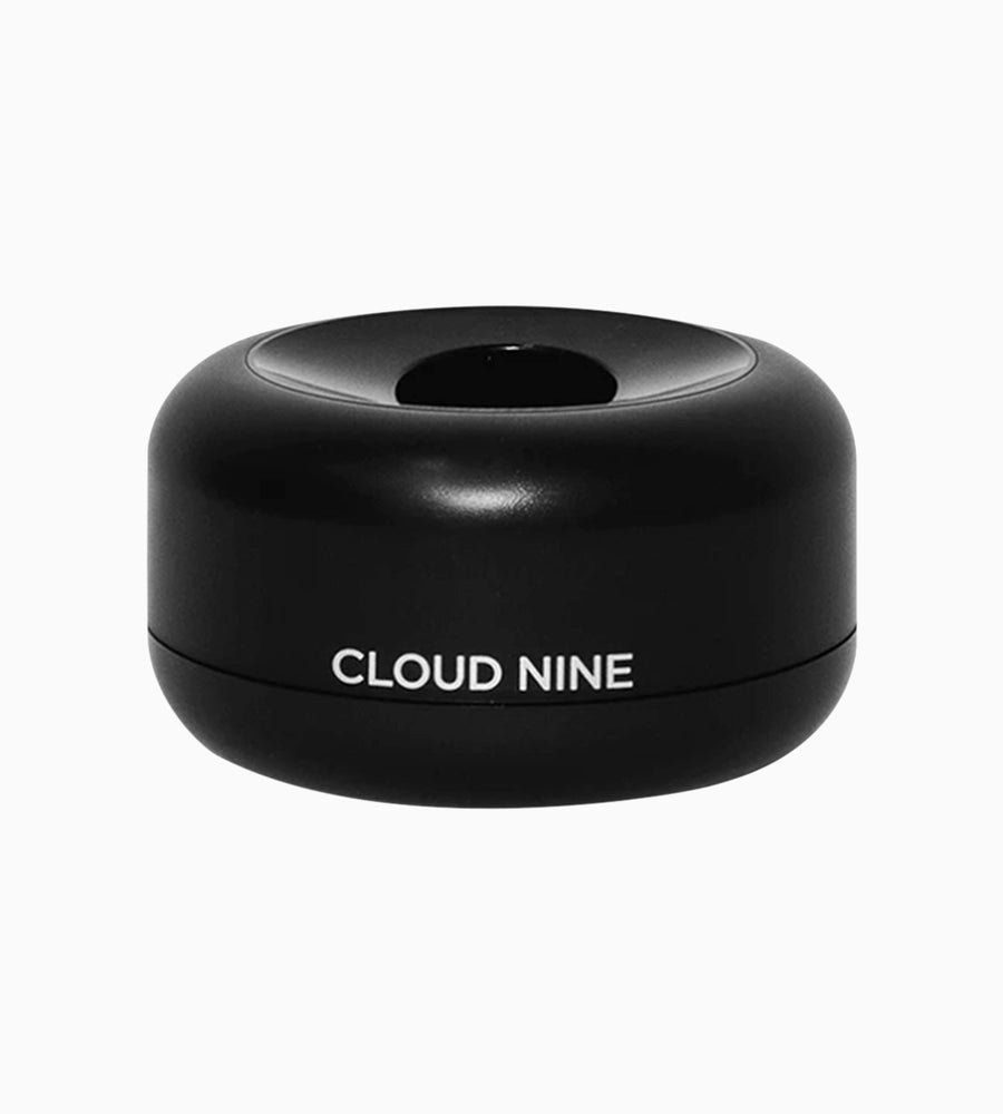 Black charging pod with CLOUD NINE branding in white.