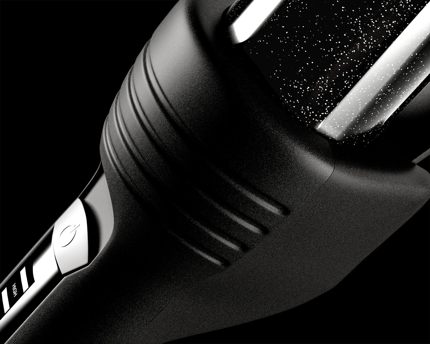 Zoomed in image of black CLOUD NINE Curling Wand handle with black background.