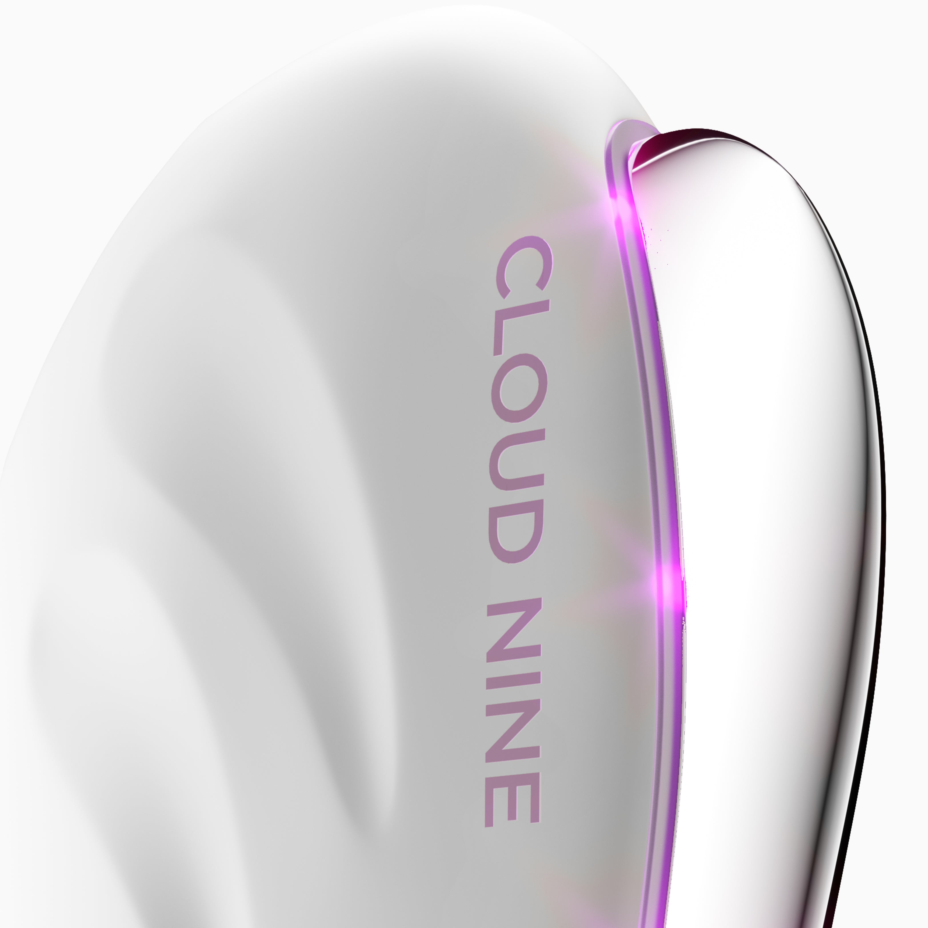 A close-up of the Redefine upright with Purple Light Therapy activated to show the device's curvature.