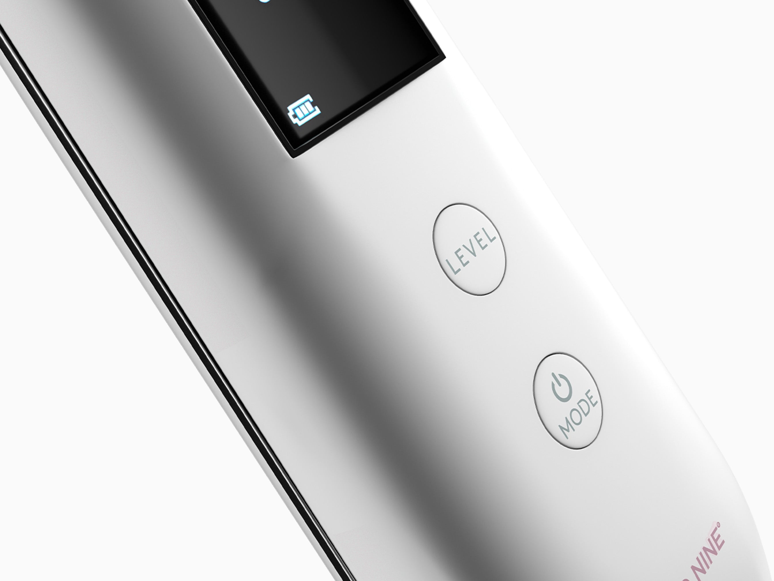 A close-up image of the back of The Rejuvenate showcasing the power and level buttons to activate the beauty device.