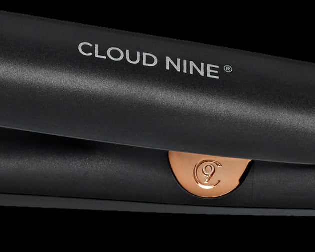 Close-up of the rose gold detailing and the CLOUD NINE logo in white on the black Alchemy Collection Touch Iron.