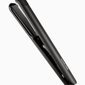 A black CLOUD NINE Touch Iron hair straightener on an angle.