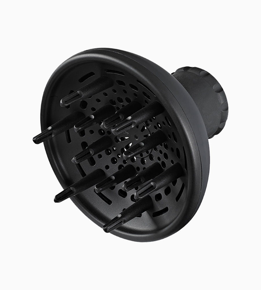 Side on image of the black diffuser attachment for The Airshot hair dryer.