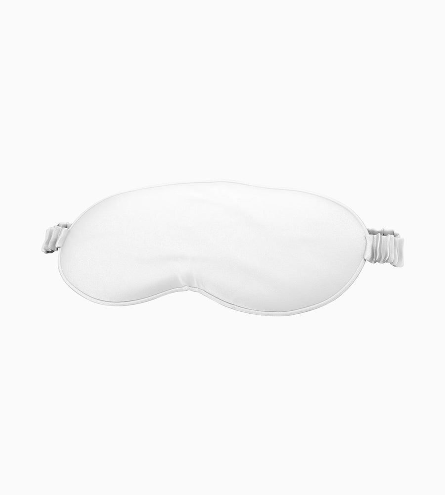 A white silk eye mask.