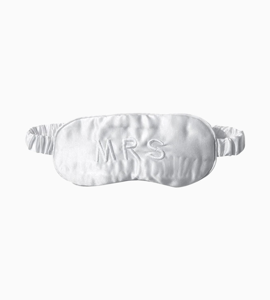 White silk eyemask with 'MRS' embroidery.