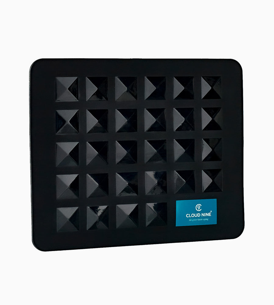 A black heat resistant mat with CLOUD NINE tag in bottom right corner.
