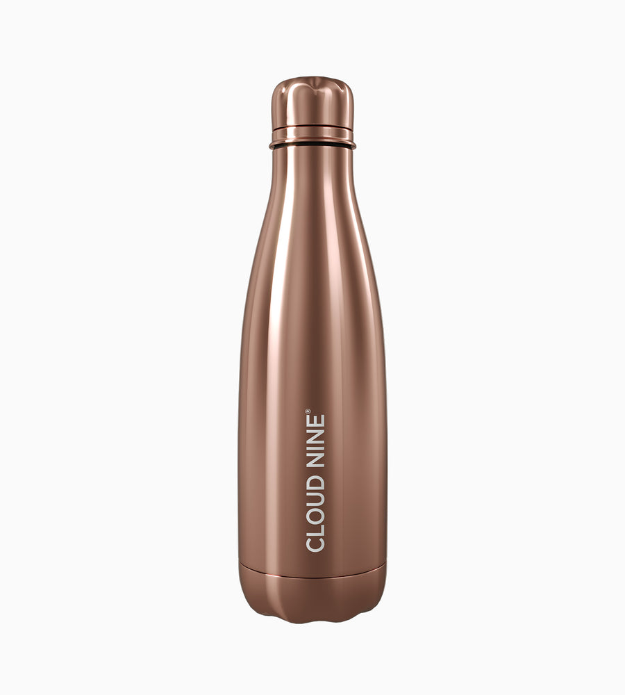 Full view of rose gold CLOUD NINE water bottle with white CLOUD NINE branding on white background.